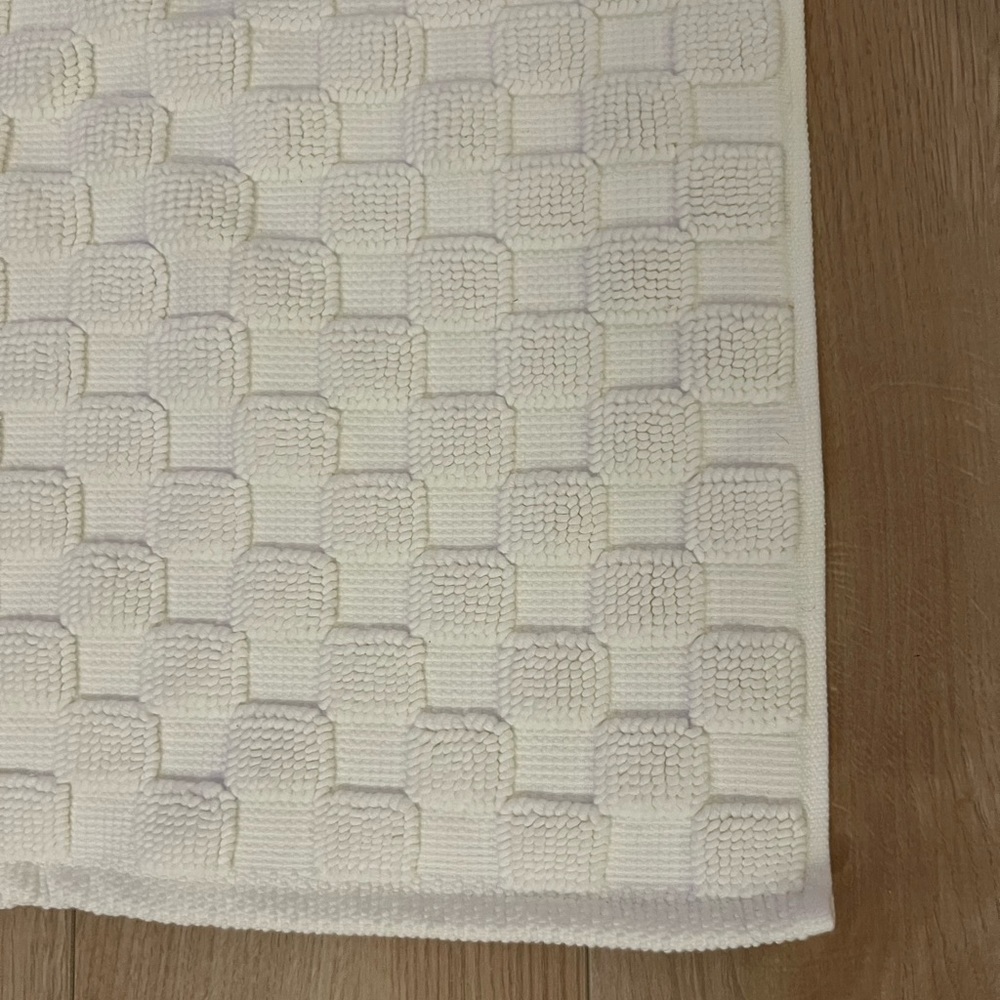 Brooklinen white checkered bath mat and bath runner